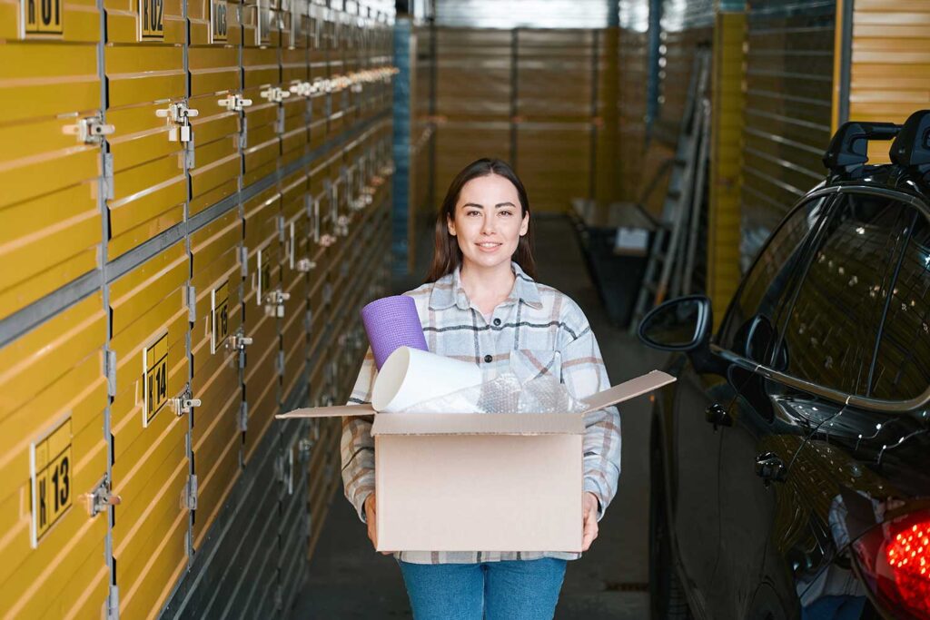 Customer carrying a box into self-storage