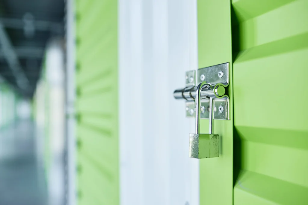 Closed-shackle padlock securing an Epic Storage unit door, demonstrating individual unit security