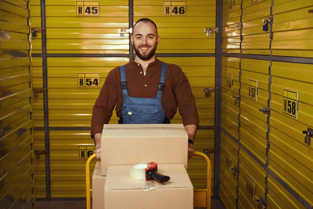 Customer moving boxes into self-storage